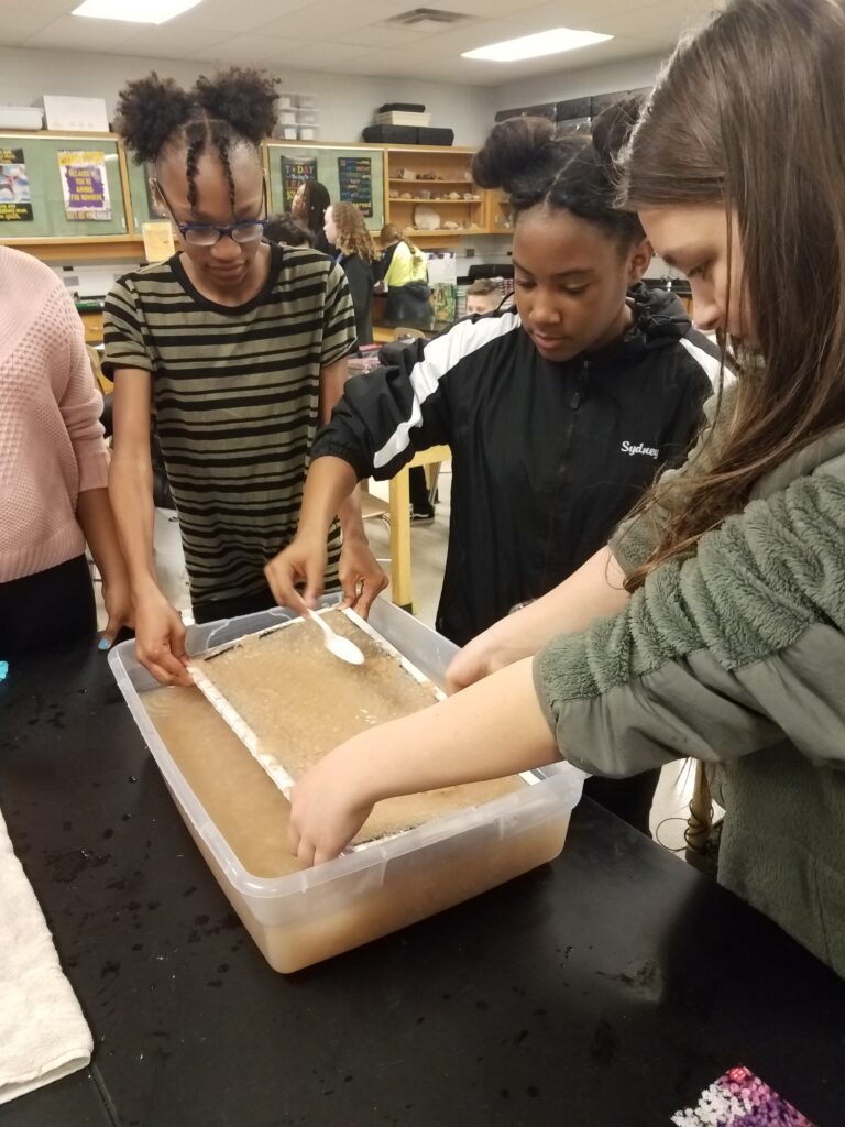 Seventh graders at Milton Somers Middle School making seed paper to promote their local honeybee population